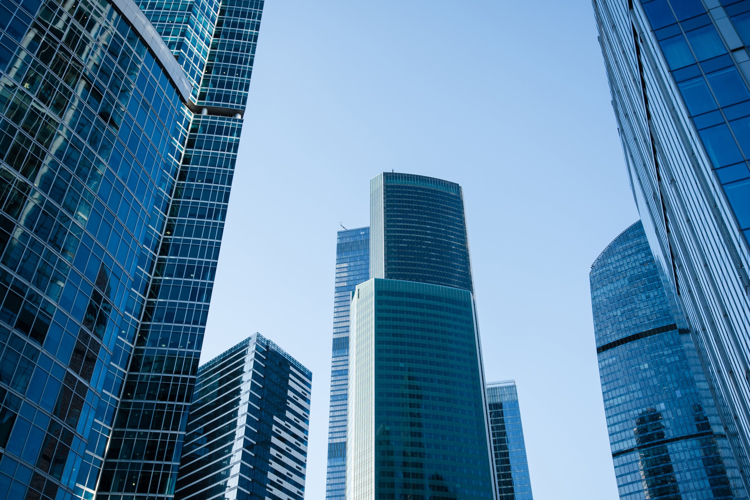 Exterior view of big company against blue sky background